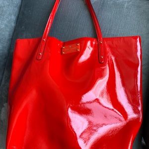 Red patent Kate Spade tote bag.